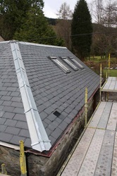 A second angle of a slanted roof where our roofing firm helped a customer get a new slate roof that they could trust