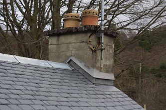 A chimney photo in Callander showing the new roof fitted by our specialists against the old style chimney
